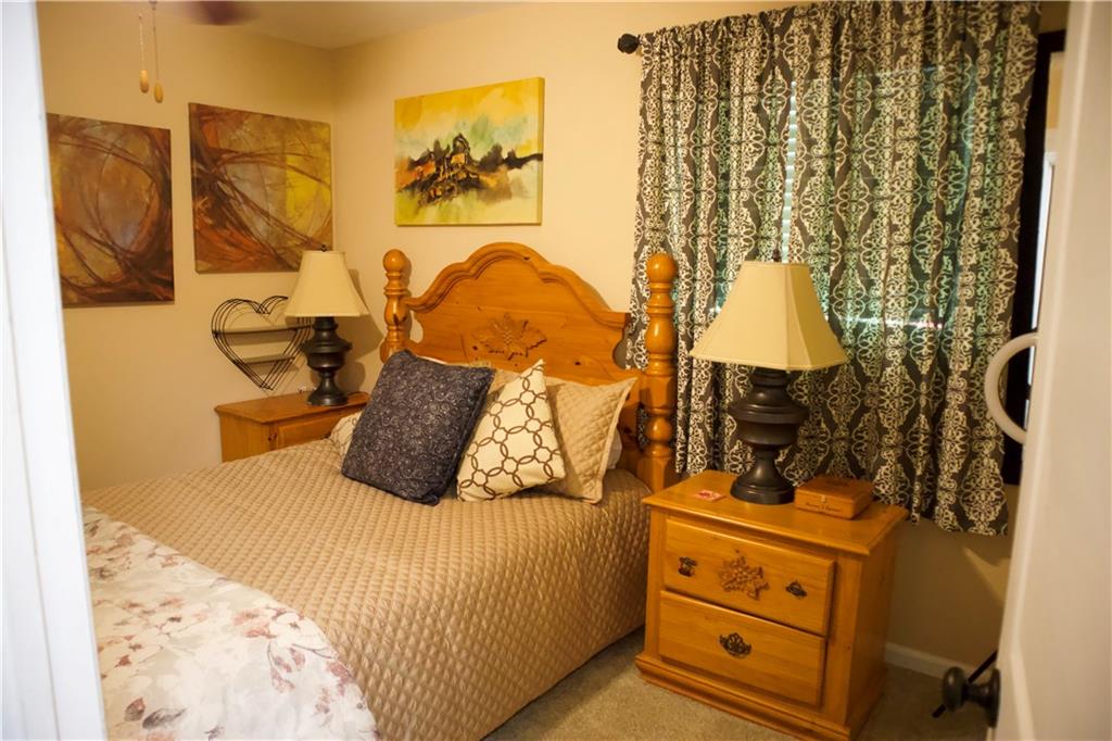 2586 Brandon Road Atlanta, GA 30337 - Photo 16 of 24 a bedroom with a bed and wall painting