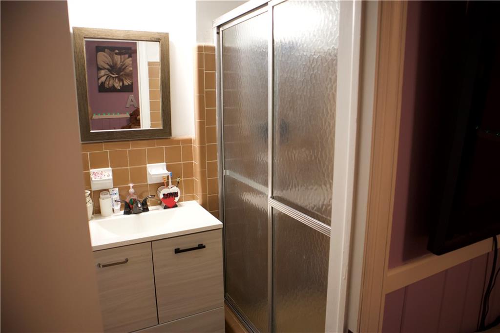 2586 Brandon Road Atlanta, GA 30337 - Photo 22 of 24 a bathroom with a sink and mirror