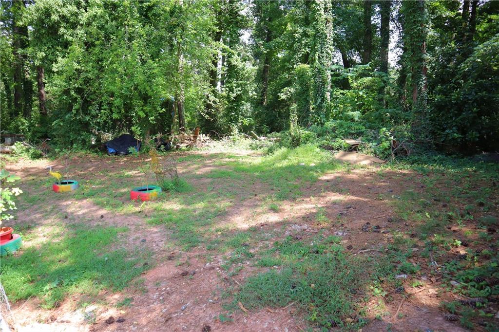 2586 Brandon Road Atlanta, GA 30337 - Photo 24 of 24 a view of yard with green space and trees in the background