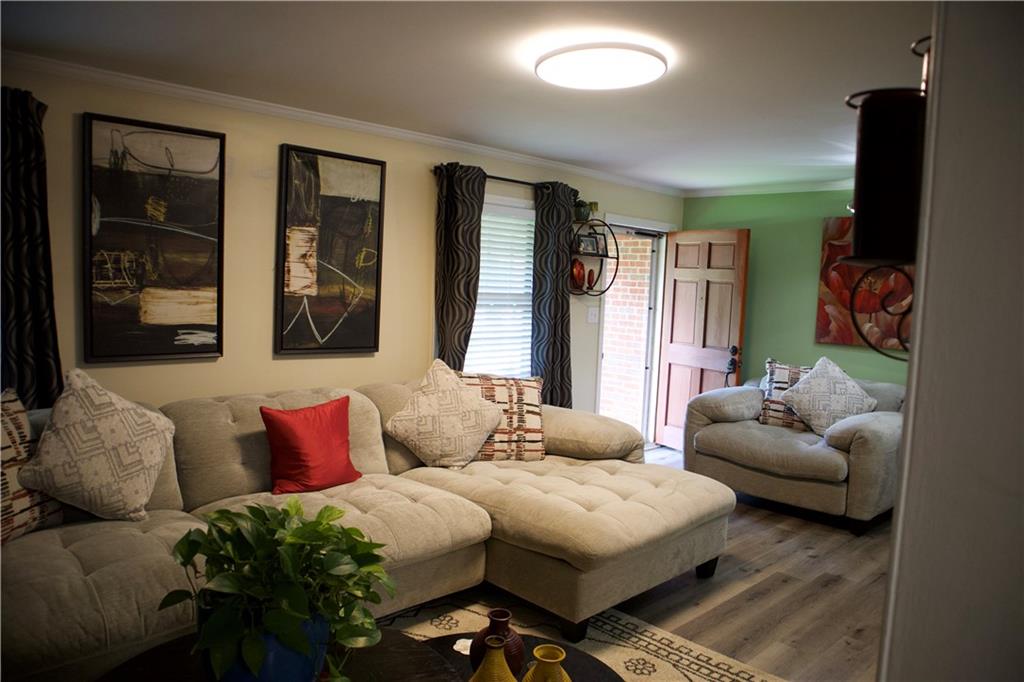 2586 Brandon Road Atlanta, GA 30337 - Photo 5 of 24 a bedroom with furniture and a large window