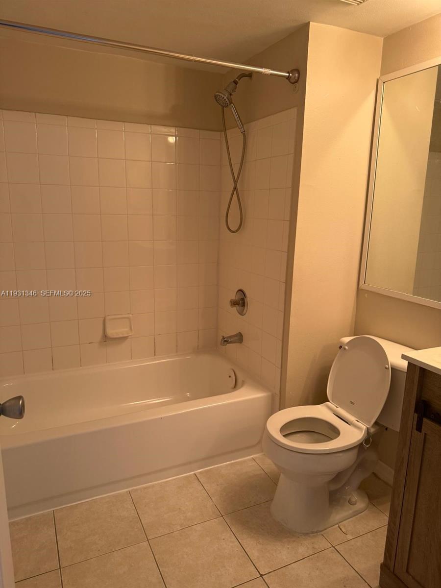 2494 Centergate Drive, Unit 201 Miramar, FL 33025 - Photo 14 of 20 a bathroom with a toilet and a shower
