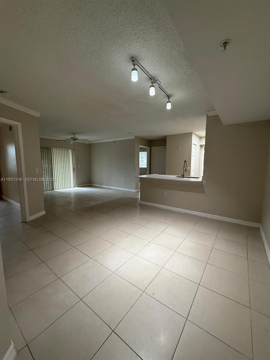 2494 Centergate Drive, Unit 201 Miramar, FL 33025 - Photo 6 of 20 a view of an empty room with a fireplace