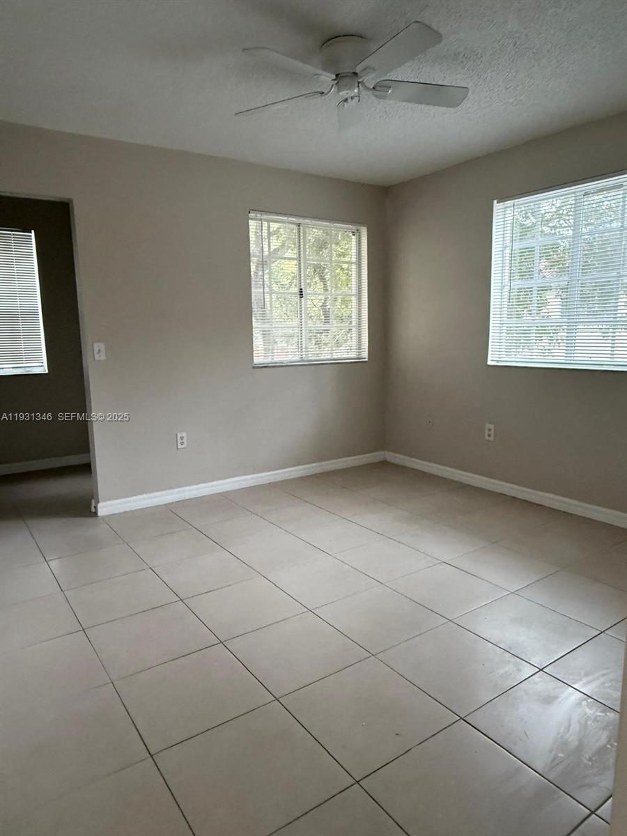 2494 Centergate Drive, Unit 201 Miramar, FL 33025 - Photo 8 of 20 a view of an empty room with a window
