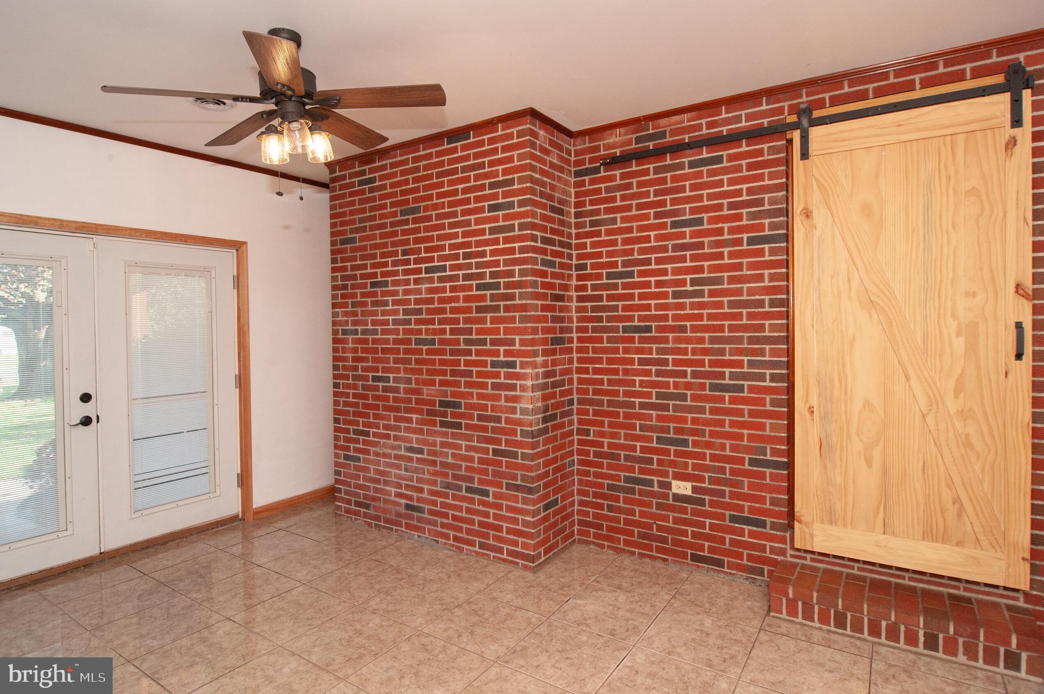 191 Irish Hill Road Felton, DE 19943 - Photo 31 of 40 Breezeway Sliding Farm Door to Kitchen