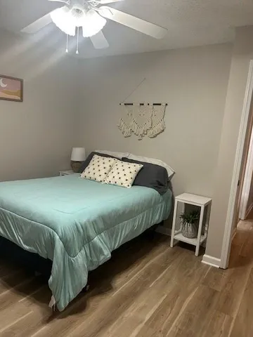 a bedroom with a bed and a chair