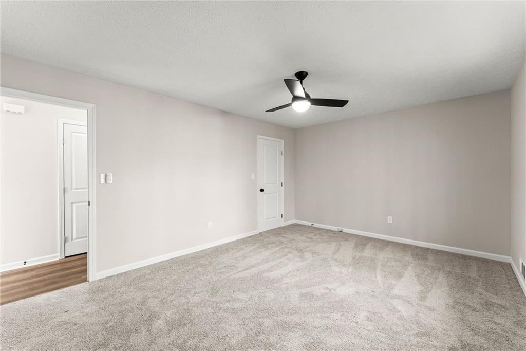 109 Tall Tree Road Athens, GA 30606 - Photo 14 of 33 a view of an empty room with chandelier fan