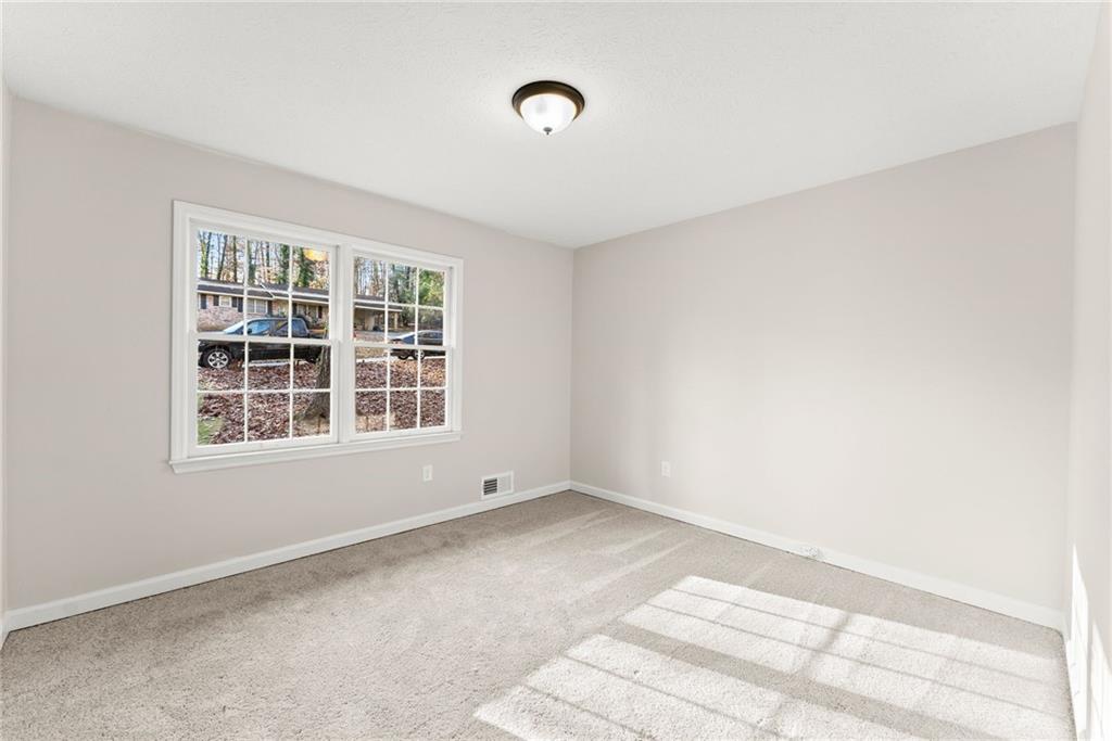 109 Tall Tree Road Athens, GA 30606 - Photo 19 of 33 a view of an empty room with a window