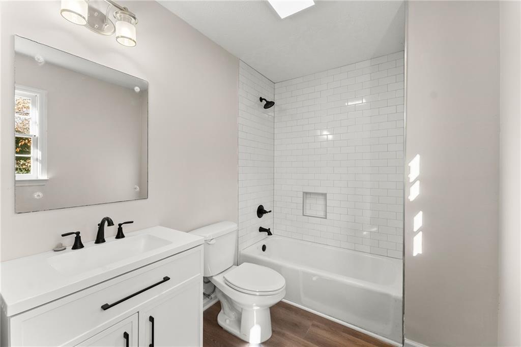 109 Tall Tree Road Athens, GA 30606 - Photo 22 of 33 a bathroom with a sink a toilet and shower