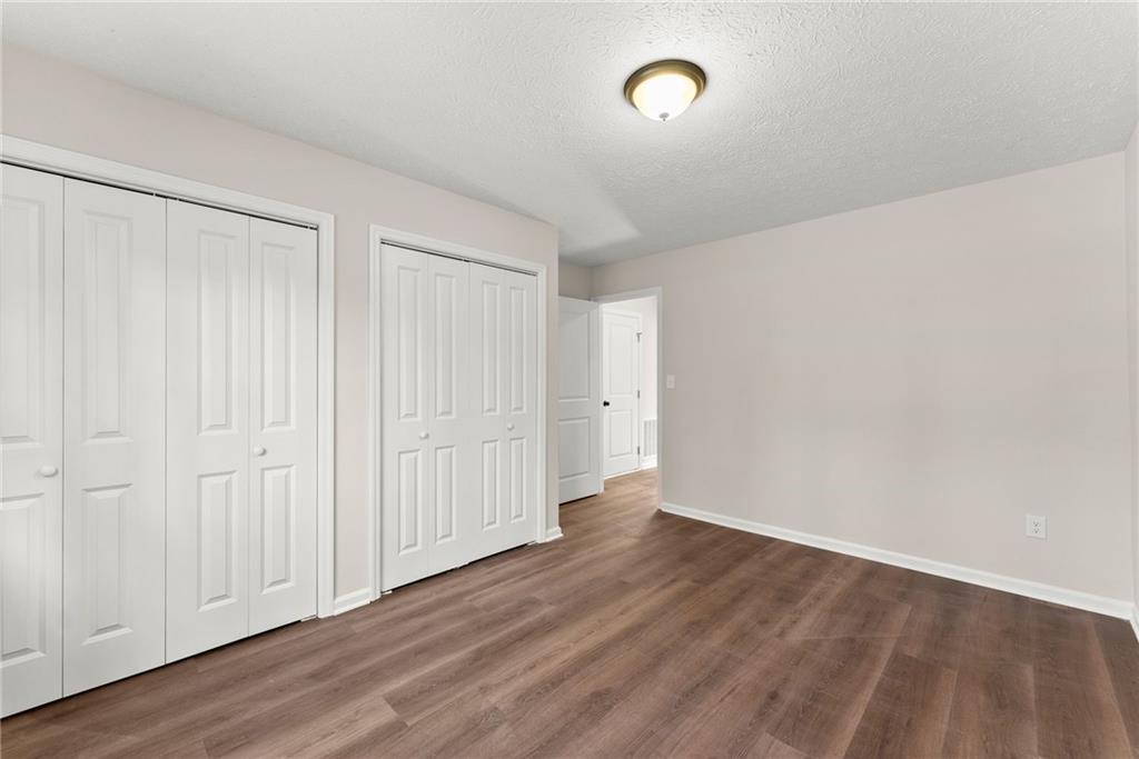 109 Tall Tree Road Athens, GA 30606 - Photo 24 of 33 a view of an empty room with wooden floor