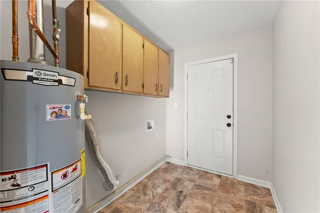 a view of hallway with washer and dryer