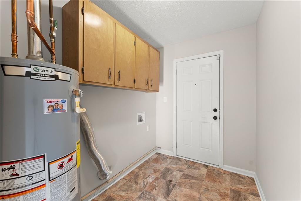 109 Tall Tree Road Athens, GA 30606 - Photo 27 of 33 a view of hallway with washer and dryer