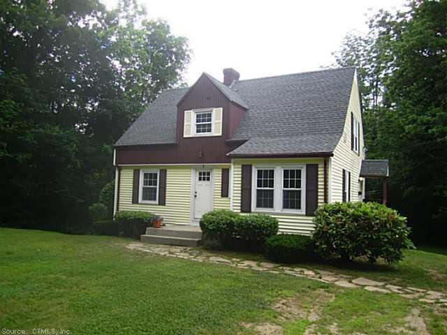 7 Mason Road Dudley, MA 01571 - Photo 1 of 1 a front view of a house with a garden