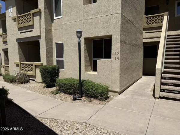 a front view of a house with stairs