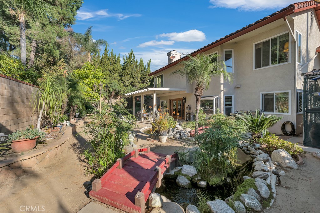 24338 Delta Drive Diamond Bar, CA 91765 - Photo 19 of 20 a front view of house with yard outdoor seating and barbeque oven
