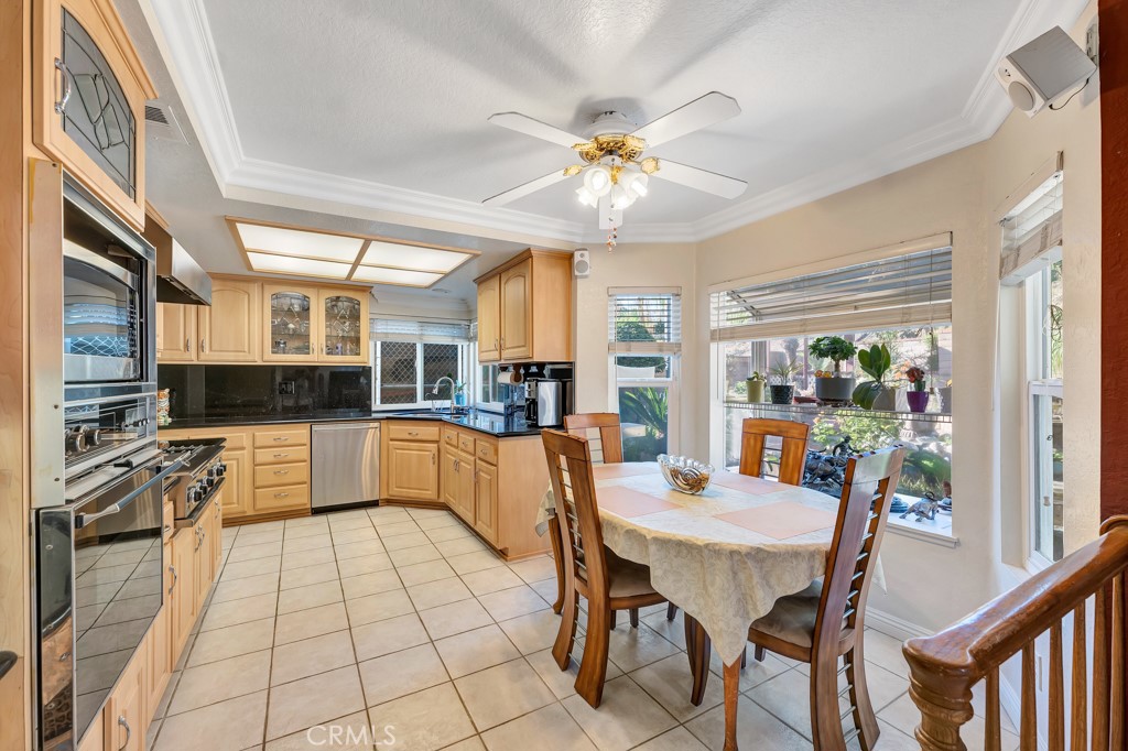 24338 Delta Drive Diamond Bar, CA 91765 - Photo 6 of 20 a large kitchen with a table and chairs
