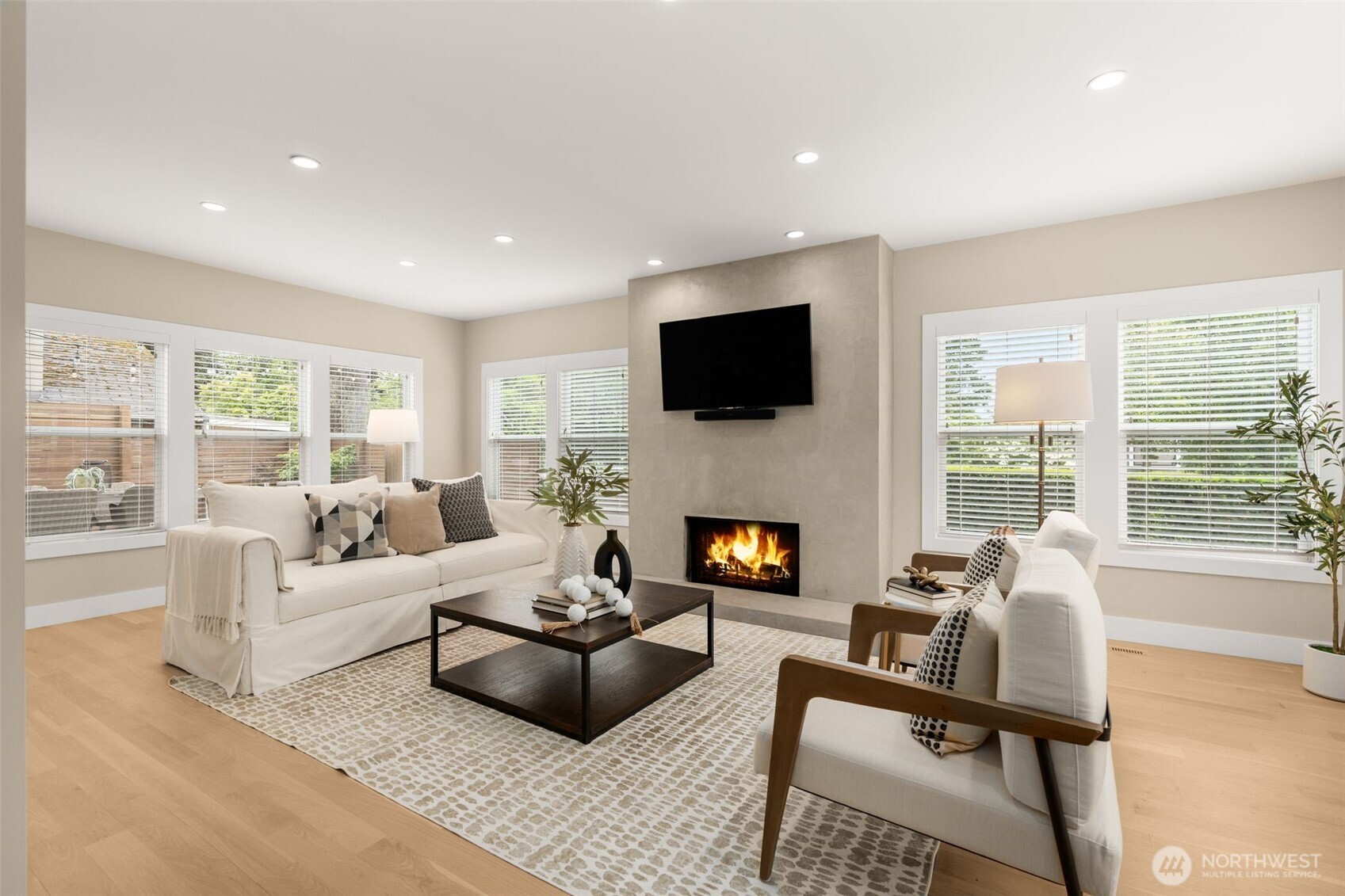 170 Lynn Street Seattle, WA 98109 - Photo 5 of 40 a living room with furniture a fireplace and a flat screen tv