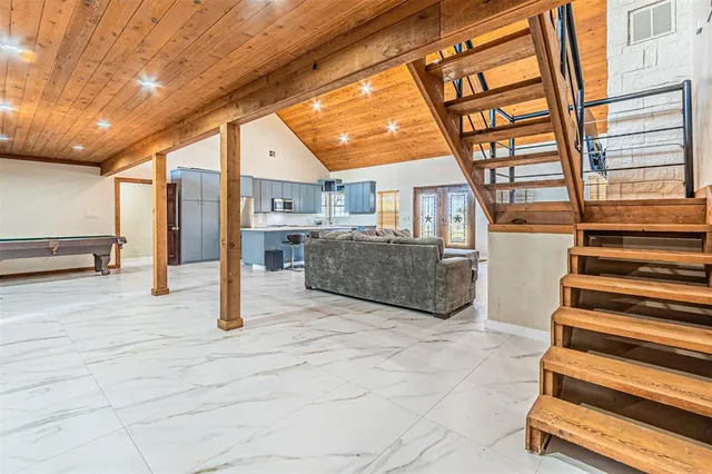 a spacious bedroom with a bed and window