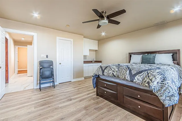 a spacious bathroom with a shower sink and mirror