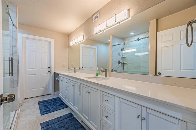 a bathroom with a shower and toilet