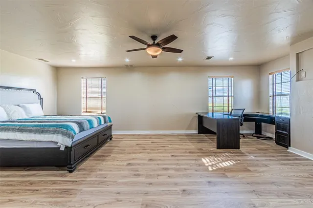 a bathroom with a tub a sink a mirror and a shower