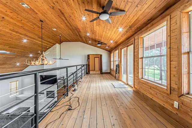 a front view of a house with a yard table and chairs