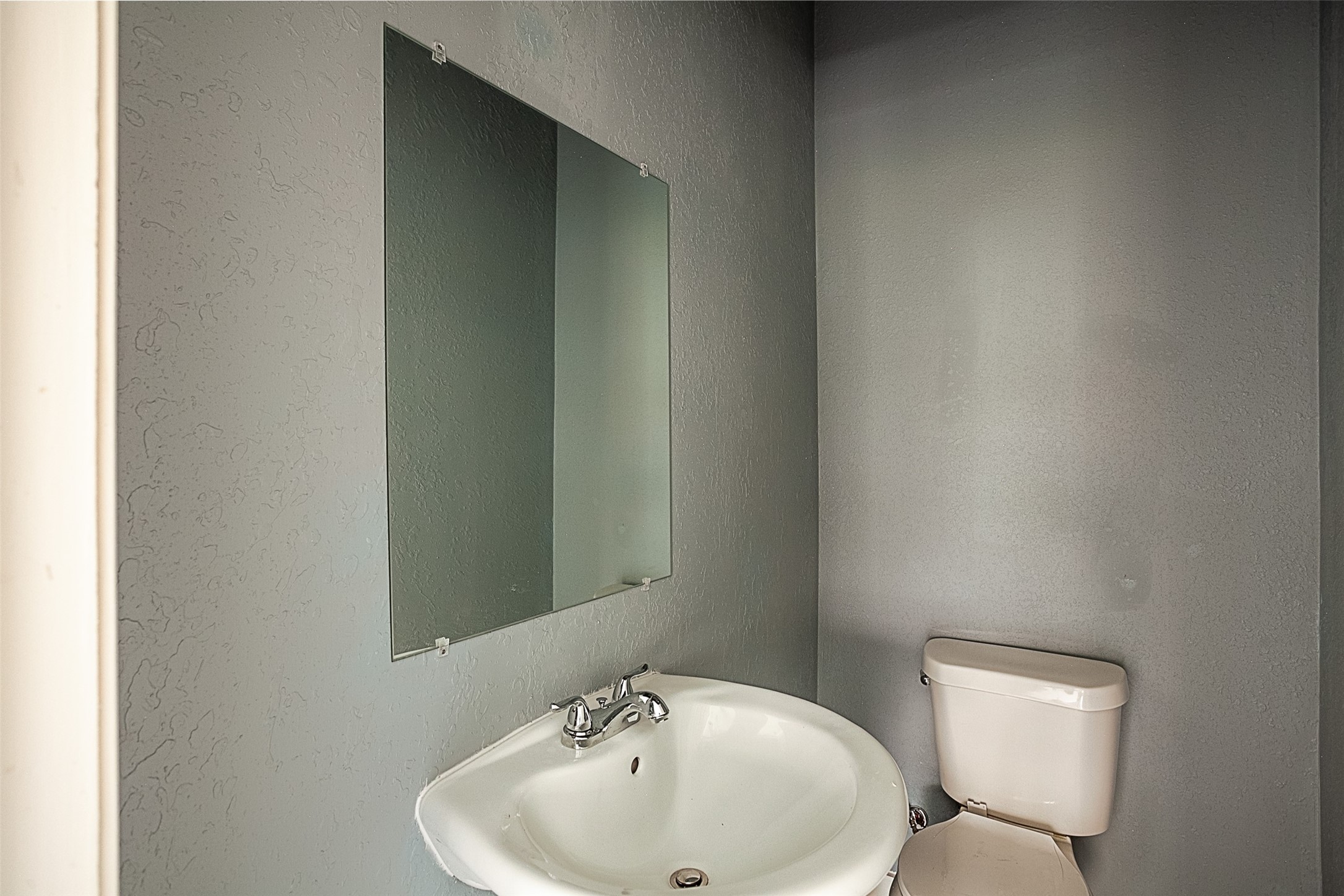 2630 Hazel Avenue Beaumont, TX 77702 - Photo 13 of 30 a bathroom with a toilet and sink