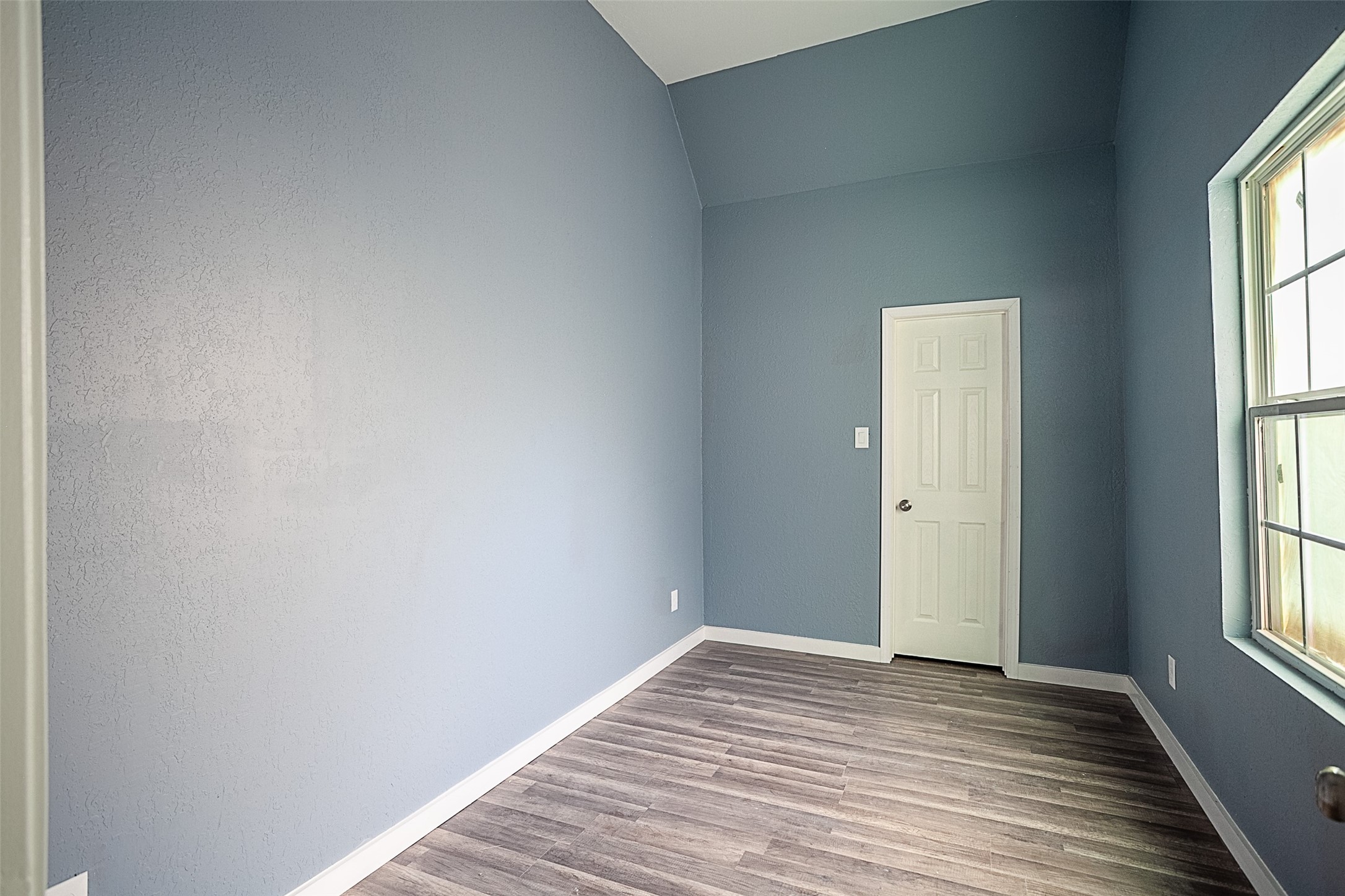 2630 Hazel Avenue Beaumont, TX 77702 - Photo 22 of 30 a view of empty room with wooden floor and fan