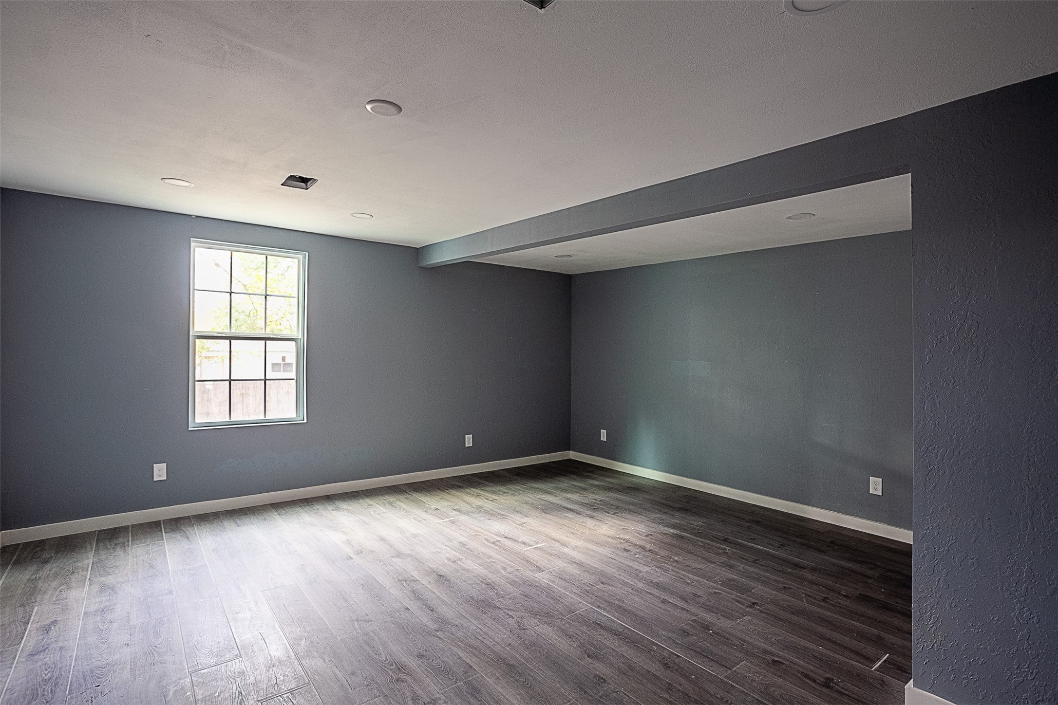 2630 Hazel Avenue Beaumont, TX 77702 - Photo 28 of 30 a view of an empty room with wooden floor and a window