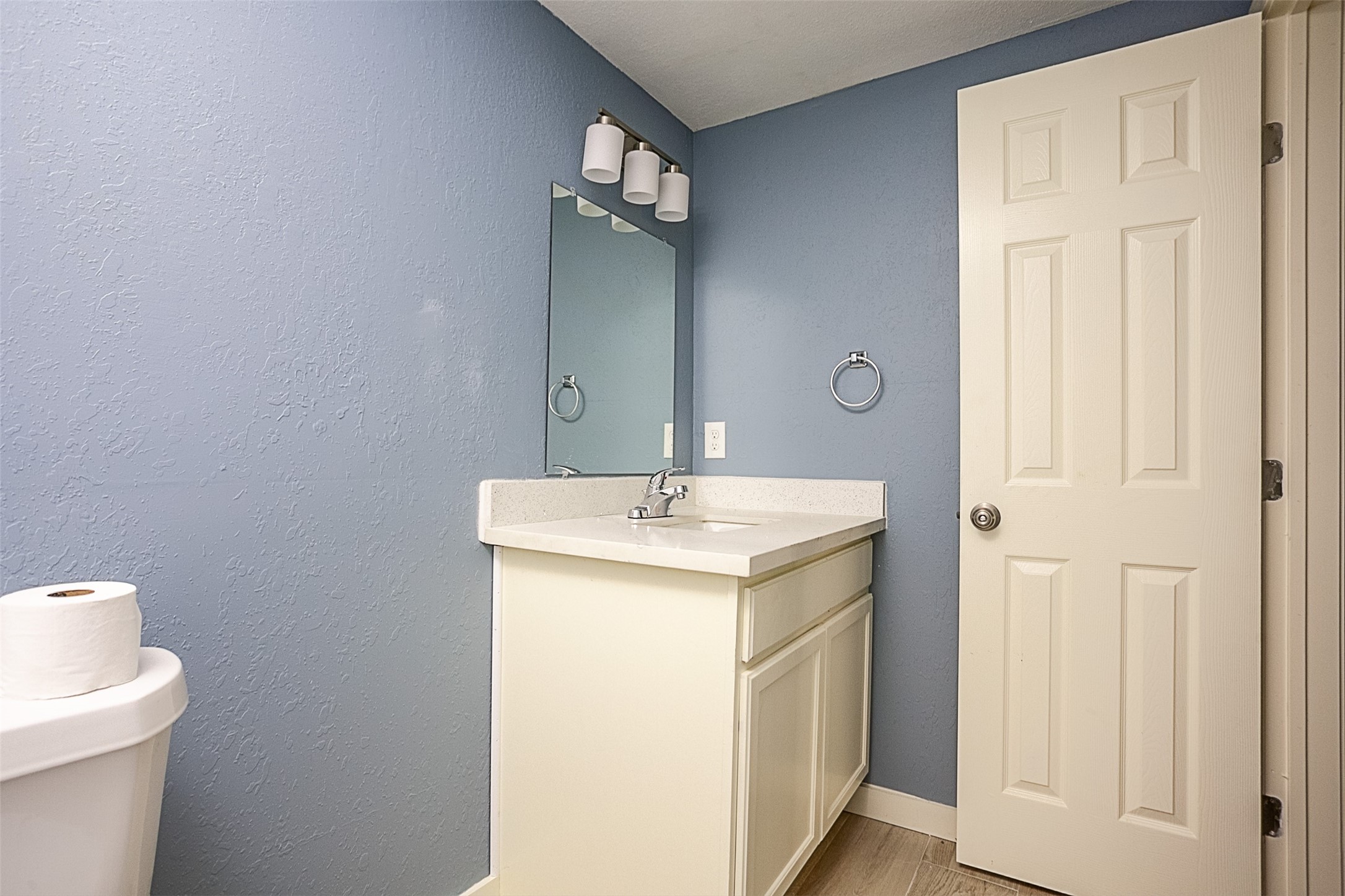 2630 Hazel Avenue Beaumont, TX 77702 - Photo 29 of 30 a bathroom with a sink and a mirror