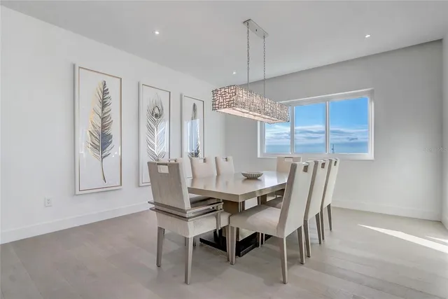 a kitchen with sink refrigerator and cabinets