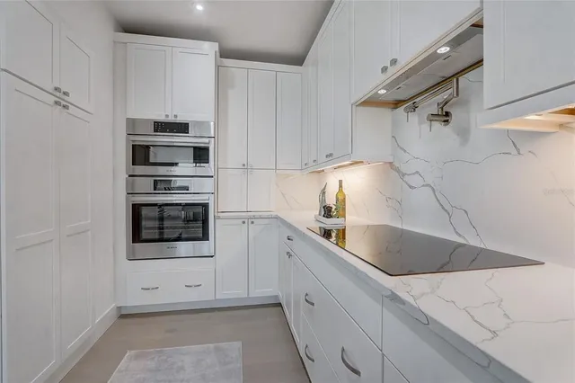 a kitchen with sink and cabinets