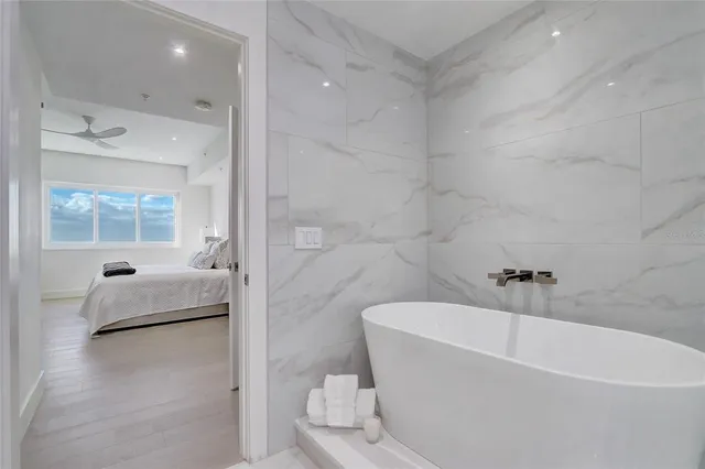 a bedroom with furniture and a flat screen tv