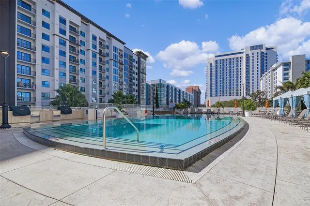a room with wooden furniture and pool table