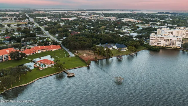an aerial view of a city with lake view