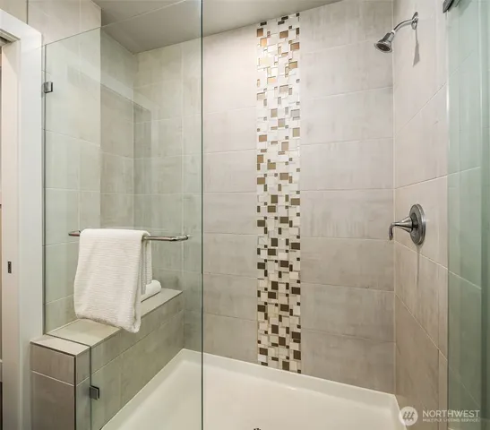 a bathroom with a shower and a sink