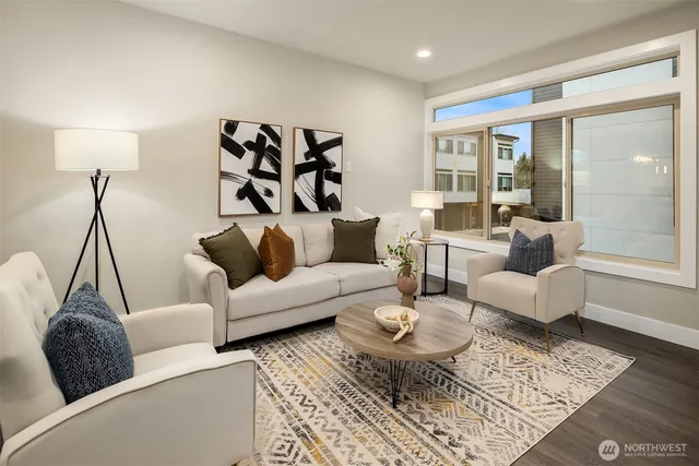 a living room with furniture and a rug