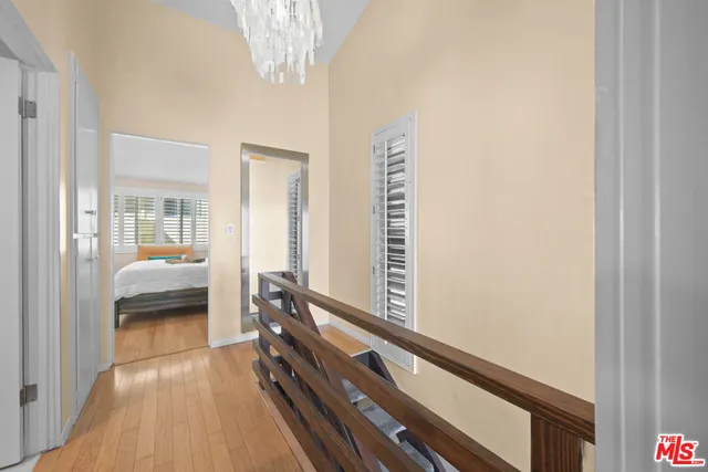 a bedroom with double bed and a large window