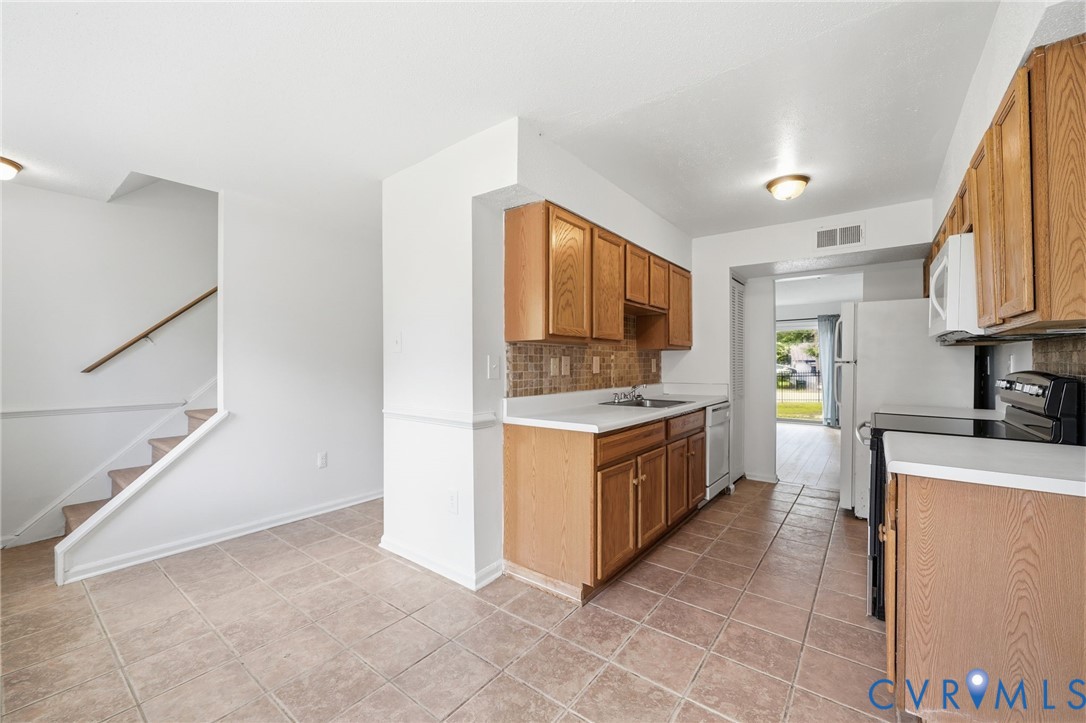 1501 Ivymount Road Richmond, VA 23225 - Photo 8 of 31 Kitchen with wood cabinetry, light countertops, an