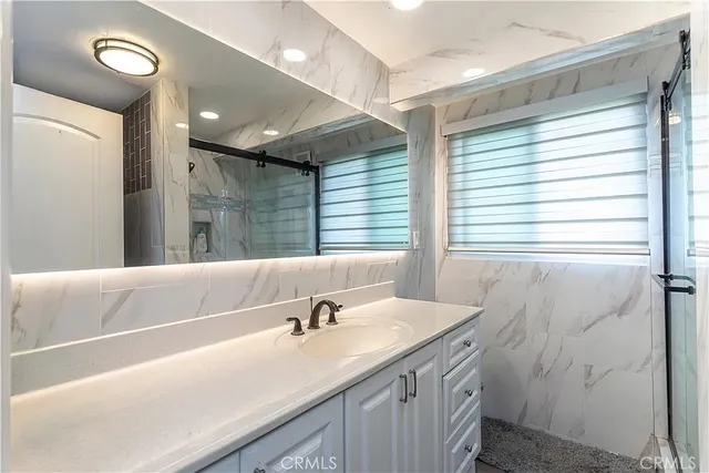 a bathroom with a toilet a sink and a window