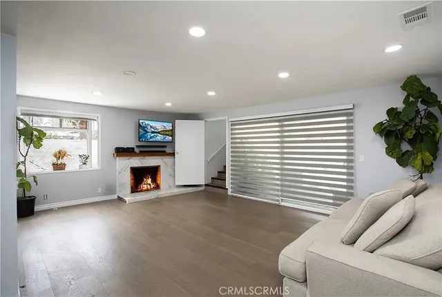 a view of livingroom with furniture and a fireplace