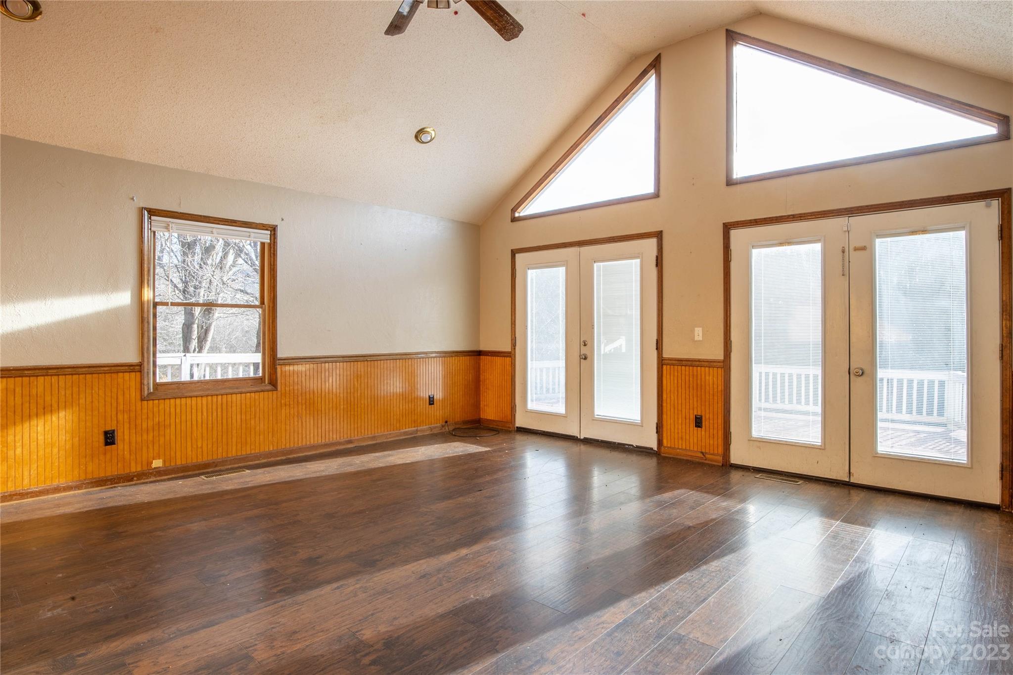 3954 Highway 80 Bakersville, NC 28705 - Photo 11 of 34 a view of an empty room with wooden floor and a window