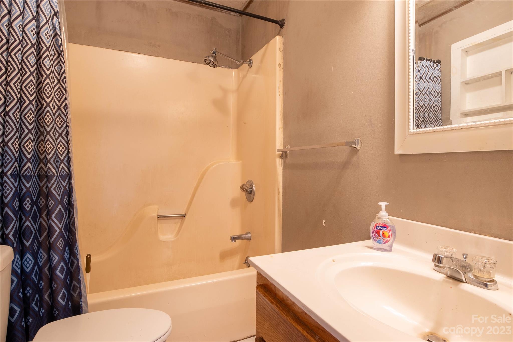 3954 Highway 80 Bakersville, NC 28705 - Photo 20 of 34 a bathroom with a sink toilet and shower