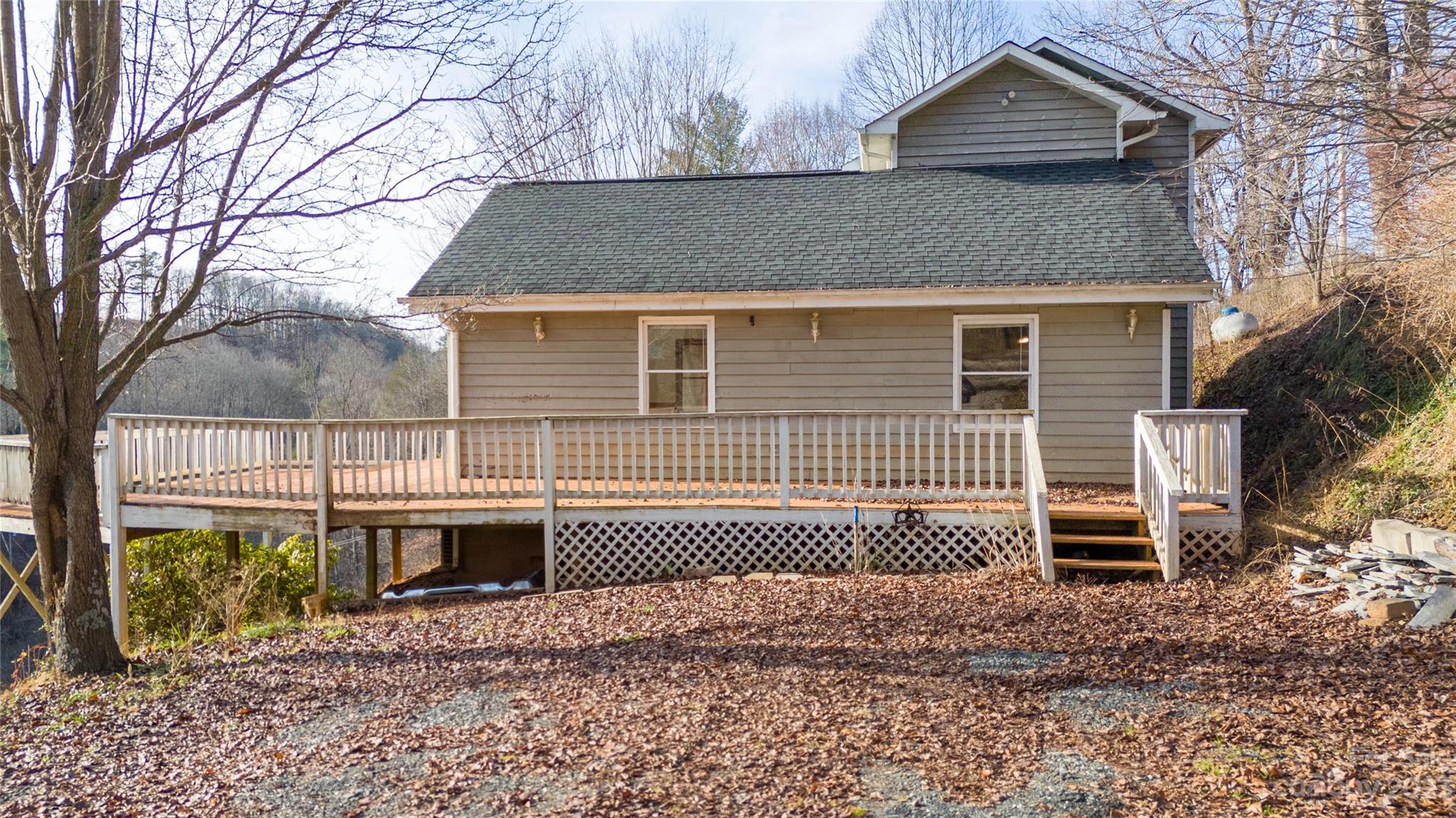 3954 Highway 80 Bakersville, NC 28705 - Photo 2 of 34 a front view of a house with a yard