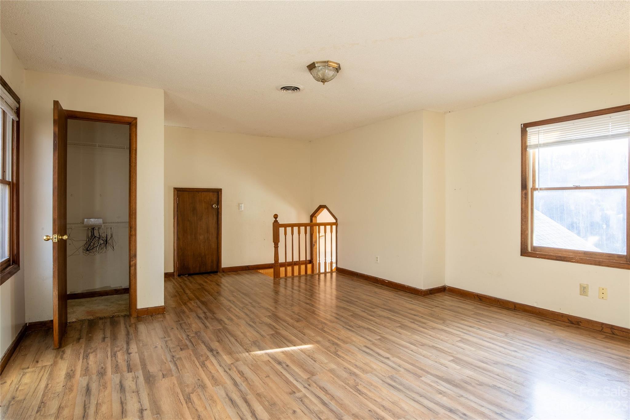 3954 Highway 80 Bakersville, NC 28705 - Photo 23 of 34 a view of an empty room with wooden floor and a window