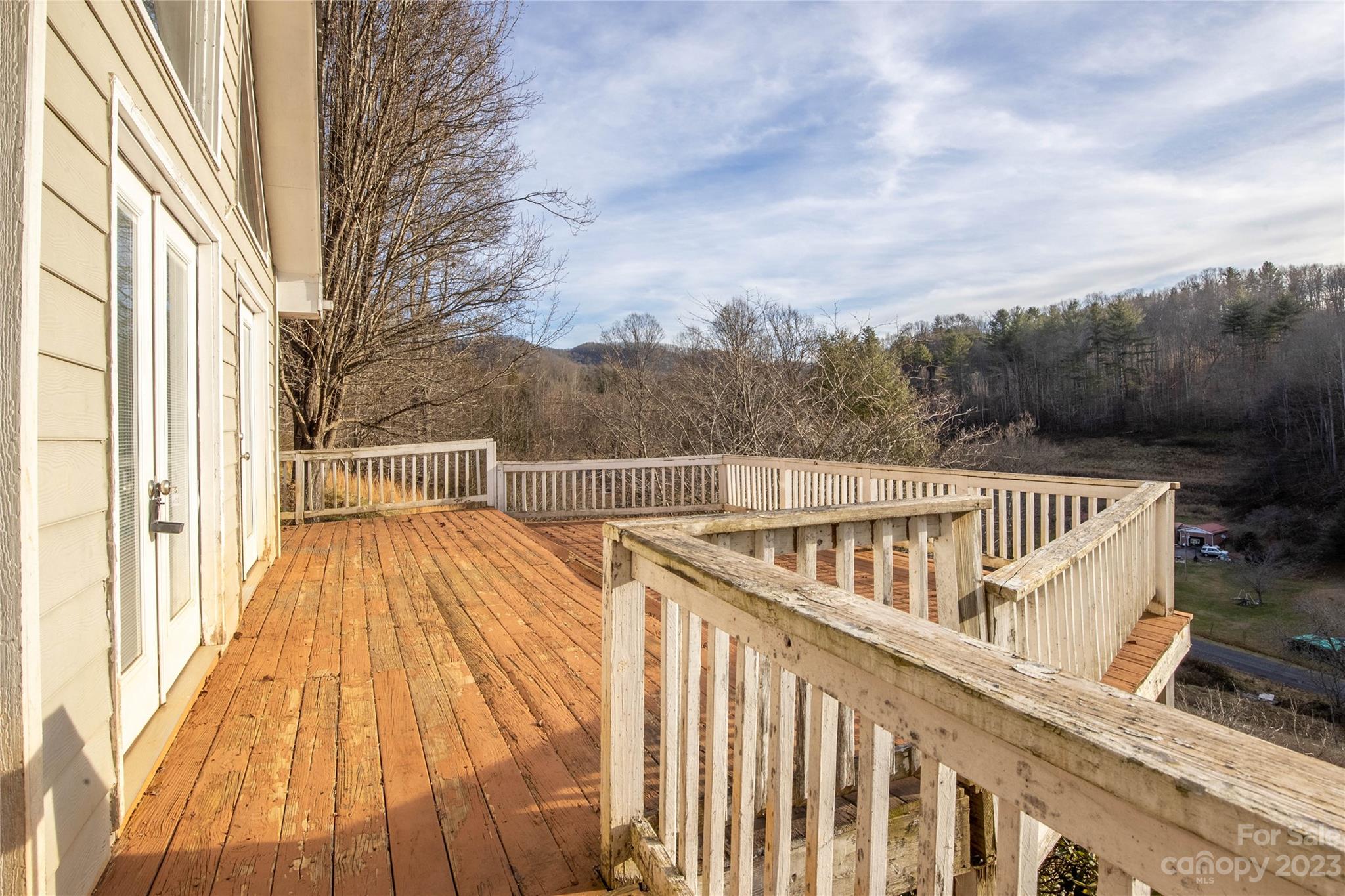 3954 Highway 80 Bakersville, NC 28705 - Photo 29 of 34 a view of balcony with wooden floor and fence