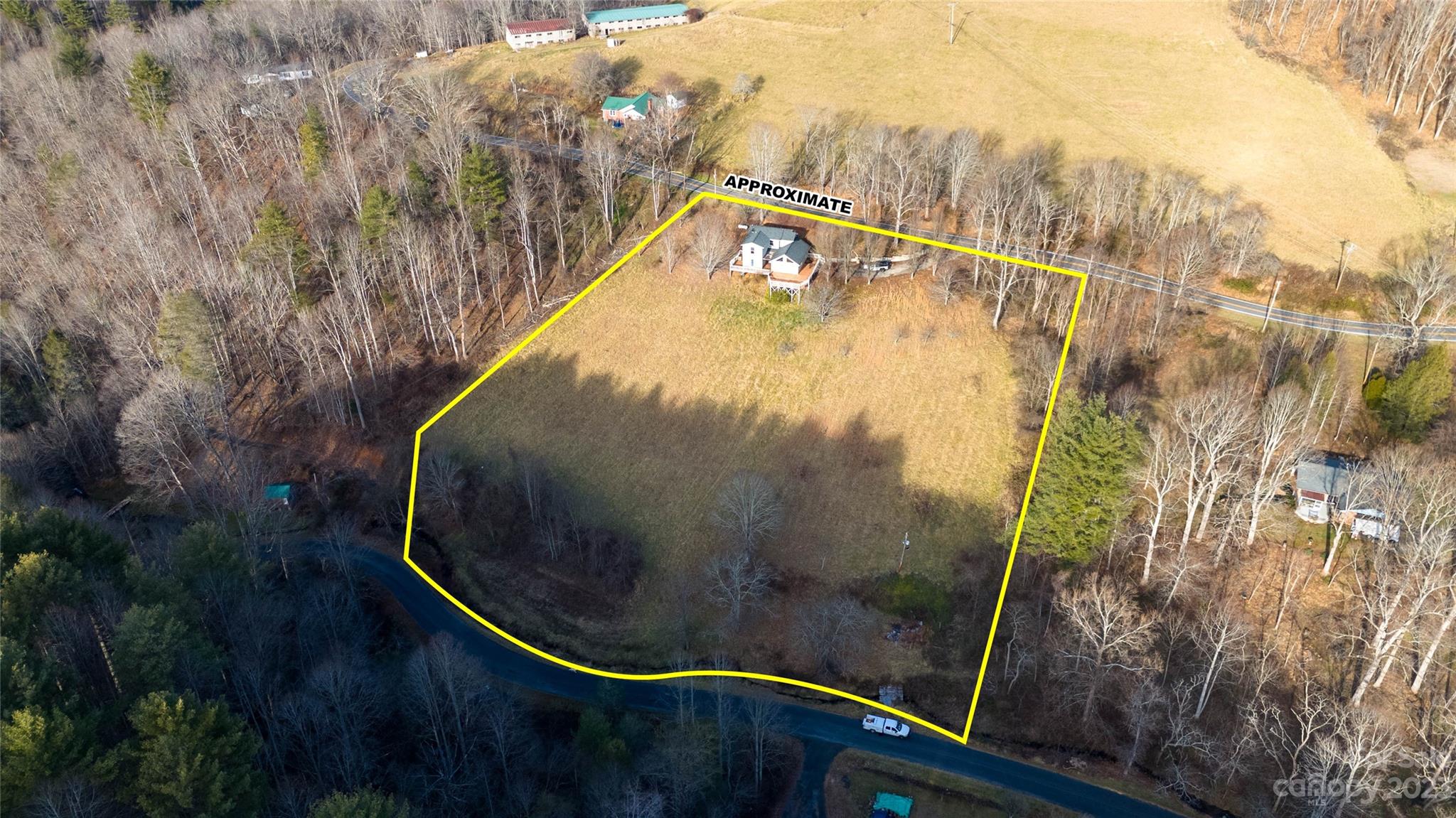 3954 Highway 80 Bakersville, NC 28705 - Photo 33 of 34 a view of a swimming pool with wooden floor and small tree in the background