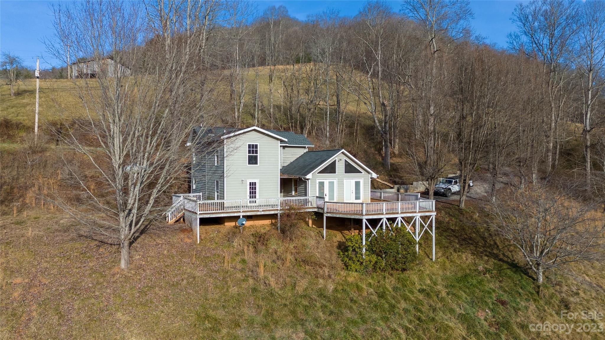 3954 Highway 80 Bakersville, NC 28705 - Photo 6 of 34 a house view with a outdoor space