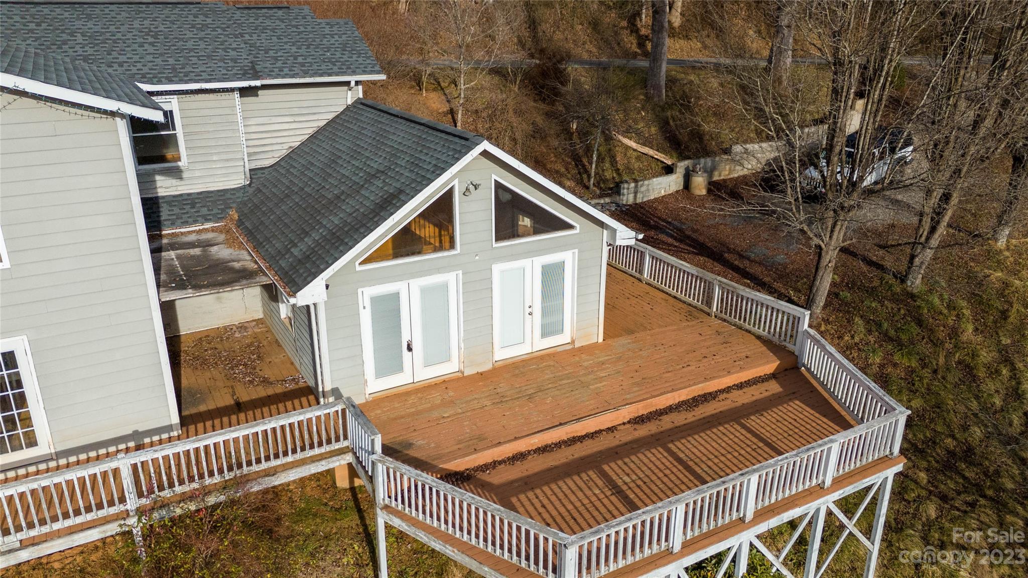 3954 Highway 80 Bakersville, NC 28705 - Photo 7 of 34 a aerial view of a house with a roof deck