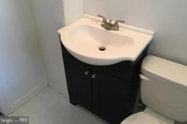 a bathroom with a sink and mirror
