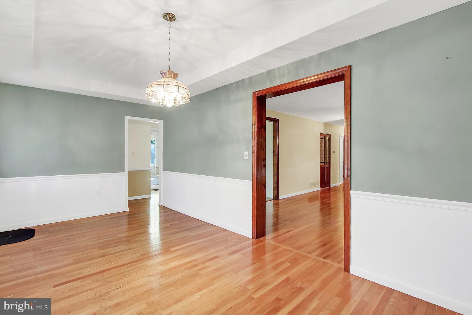 7846 North Cove Road Baltimore, MD 21219 - Photo 6 of 30 Dining Room with Tray Ceiling and Chair Railing